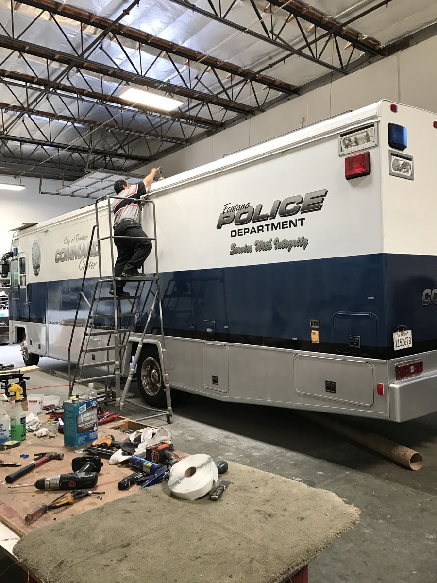 Technician working on a Fontana Police Department command center RV
